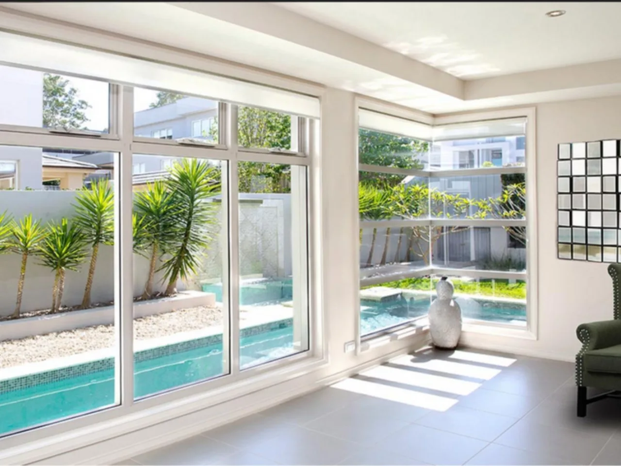 Fixed and opening aluminium windows beside a pool