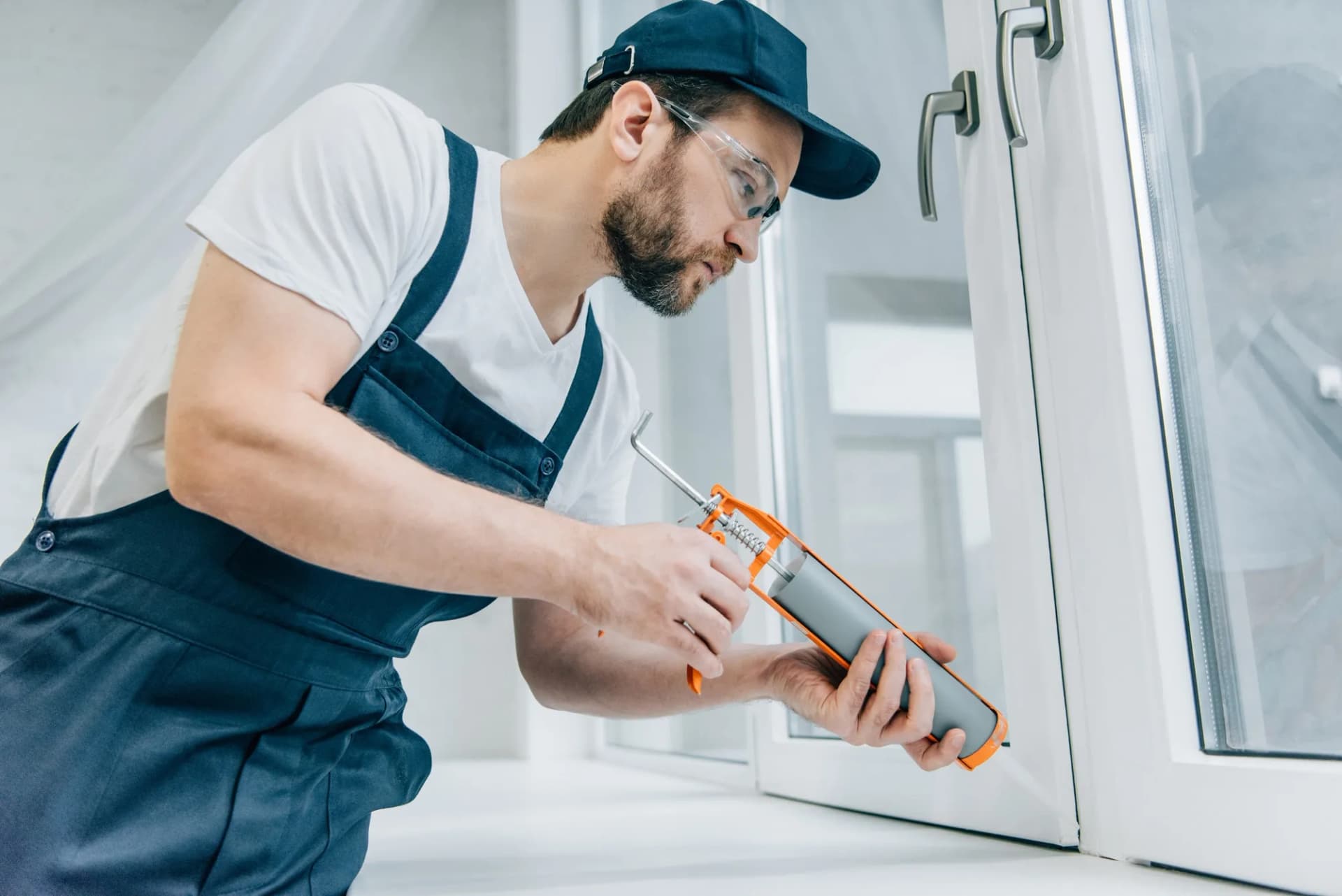 Sealing a window frame with a sealant gun