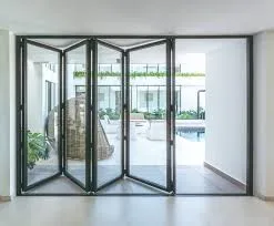 Six-panel aluminium folding door closed, seen from a hallway with daylight behind