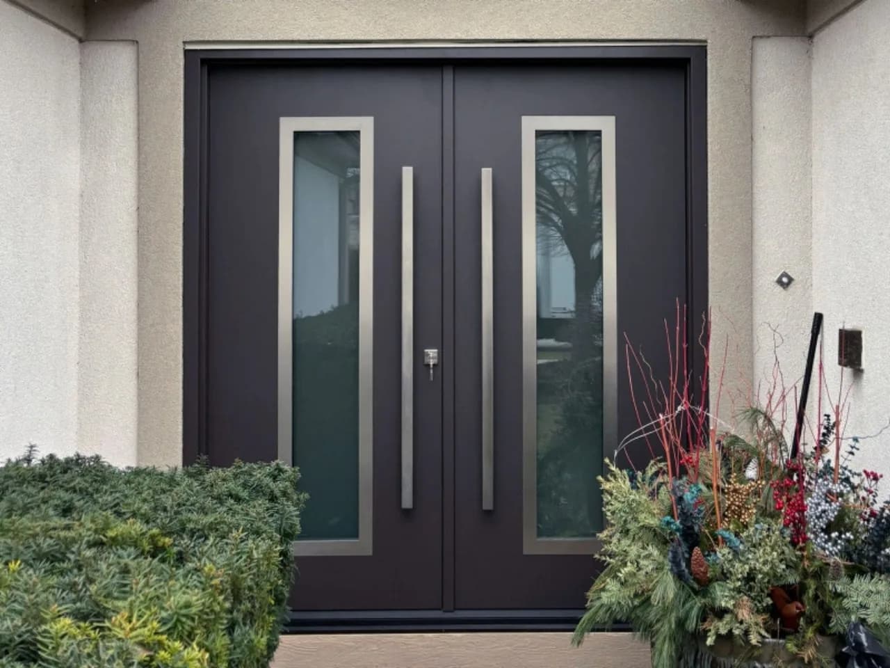 Charcoal aluminium front door with a long pull handle and side light